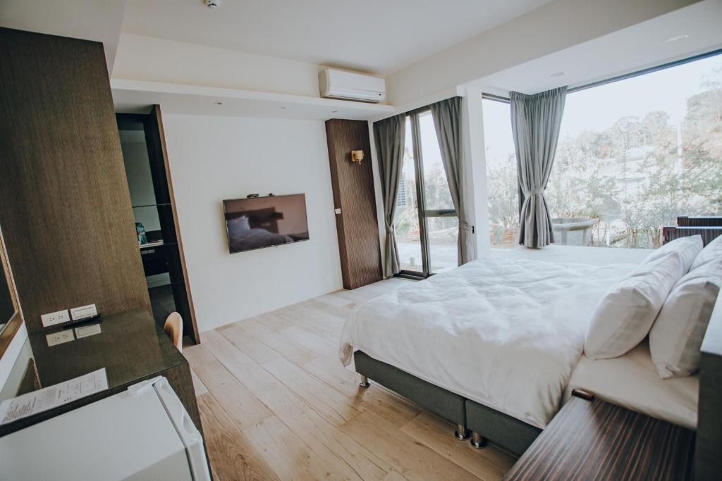 Postel nebo postele na pokoji v ubytování Ruili Tea Villa