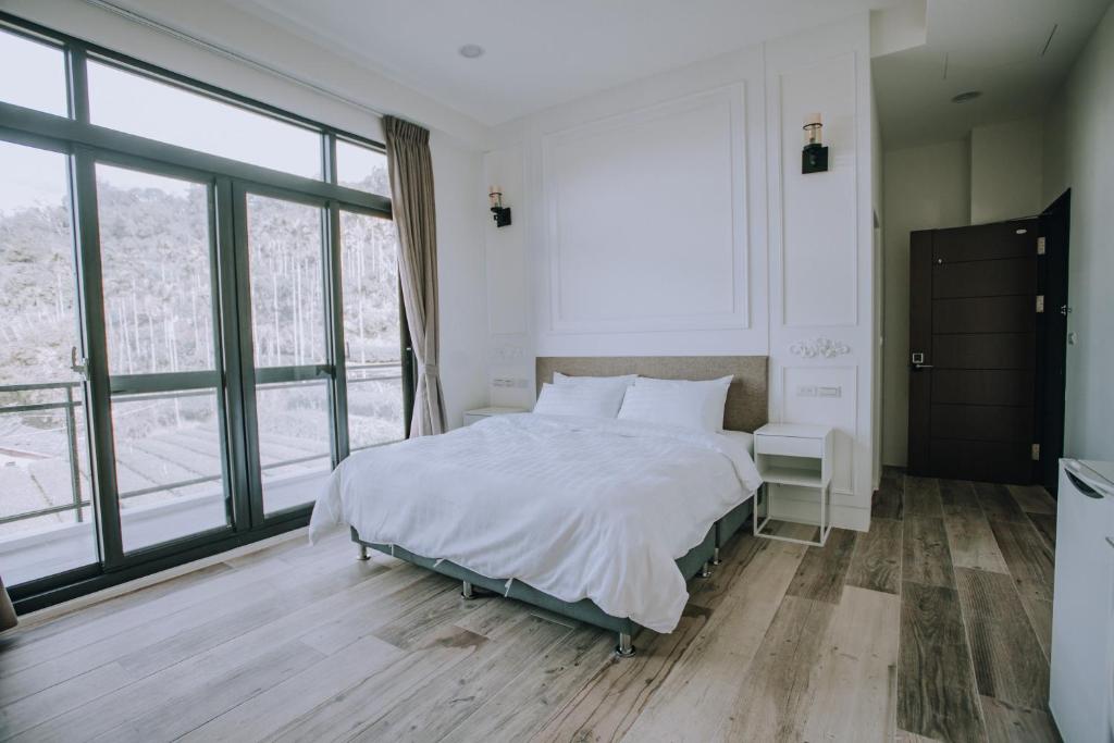 Postel nebo postele na pokoji v ubytování Ruili Tea Villa