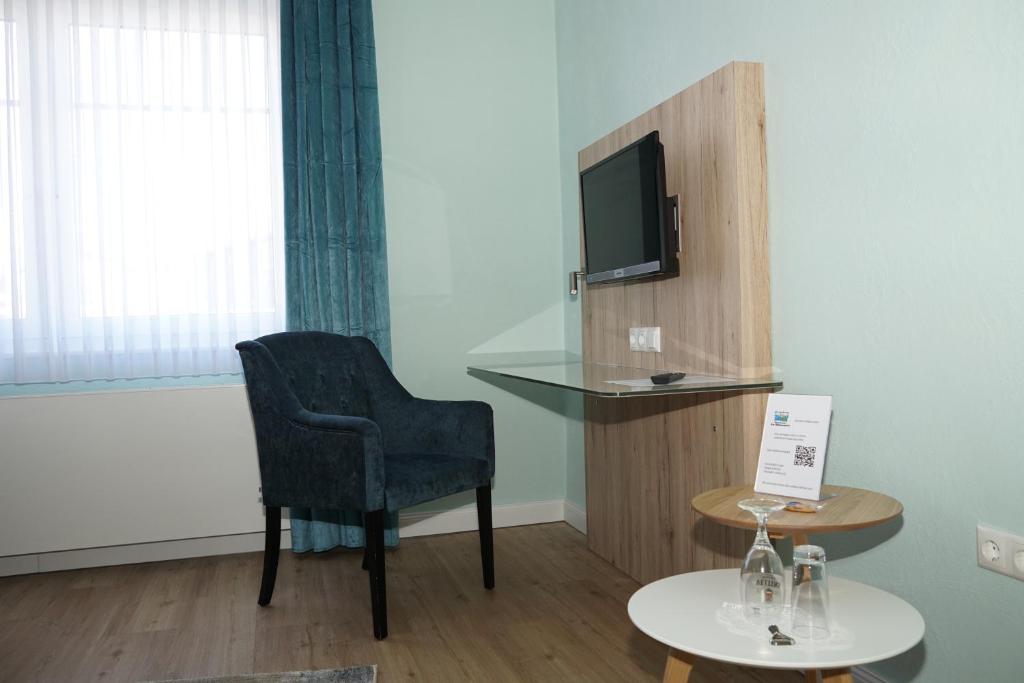TV a/nebo společenská místnost v ubytování Hotel-Pension Am Böhmepark