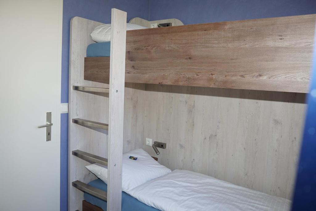 Postel nebo postele na pokoji v ubytování Hotel-Pension Am Böhmepark