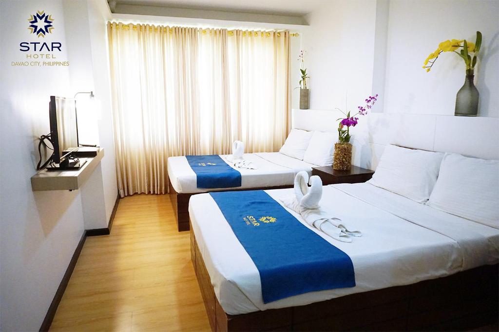Postel nebo postele na pokoji v ubytování Star Hotel