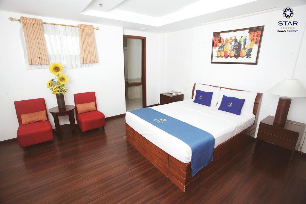 Postel nebo postele na pokoji v ubytování Star Hotel