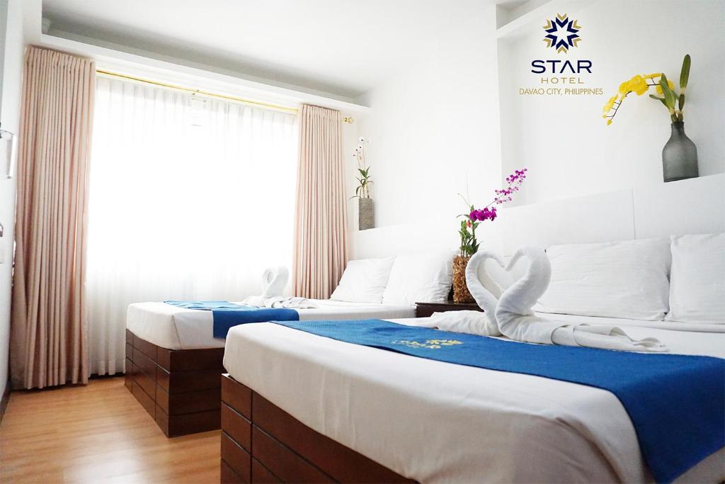 Postel nebo postele na pokoji v ubytování Star Hotel