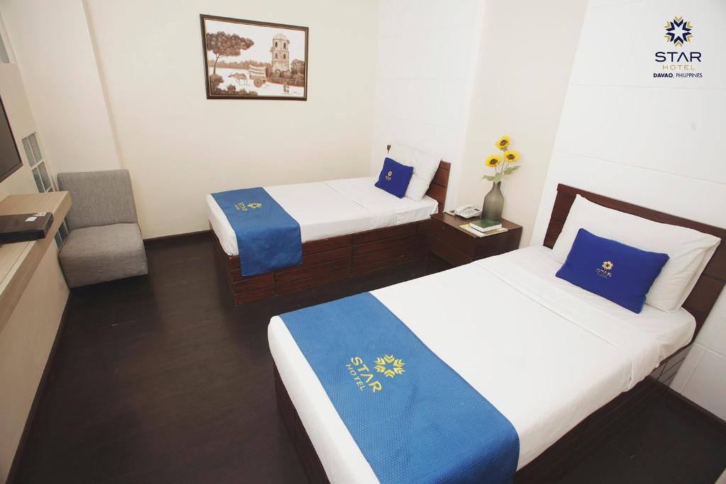Postel nebo postele na pokoji v ubytování Star Hotel