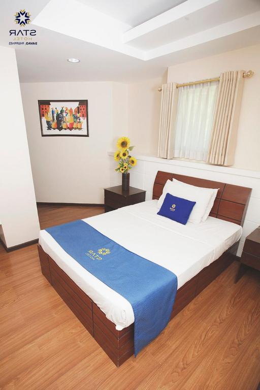 Postel nebo postele na pokoji v ubytování Star Hotel