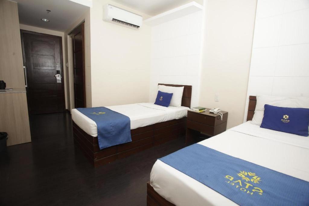 Postel nebo postele na pokoji v ubytování Star Hotel