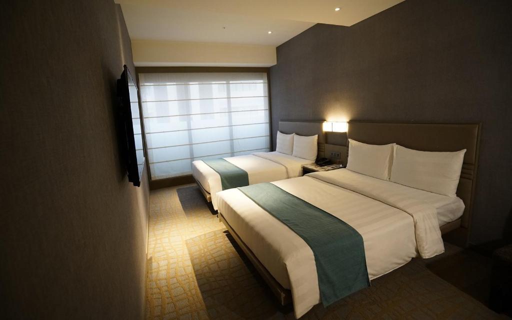 Postel nebo postele na pokoji v ubytování Hotel Midtown Richardson