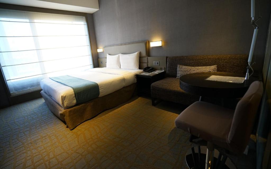 Postel nebo postele na pokoji v ubytování Hotel Midtown Richardson