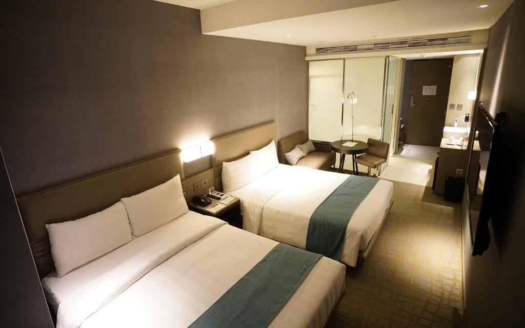Postel nebo postele na pokoji v ubytování Hotel Midtown Richardson