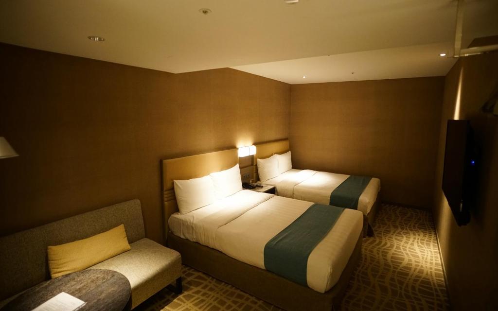 Postel nebo postele na pokoji v ubytování Hotel Midtown Richardson