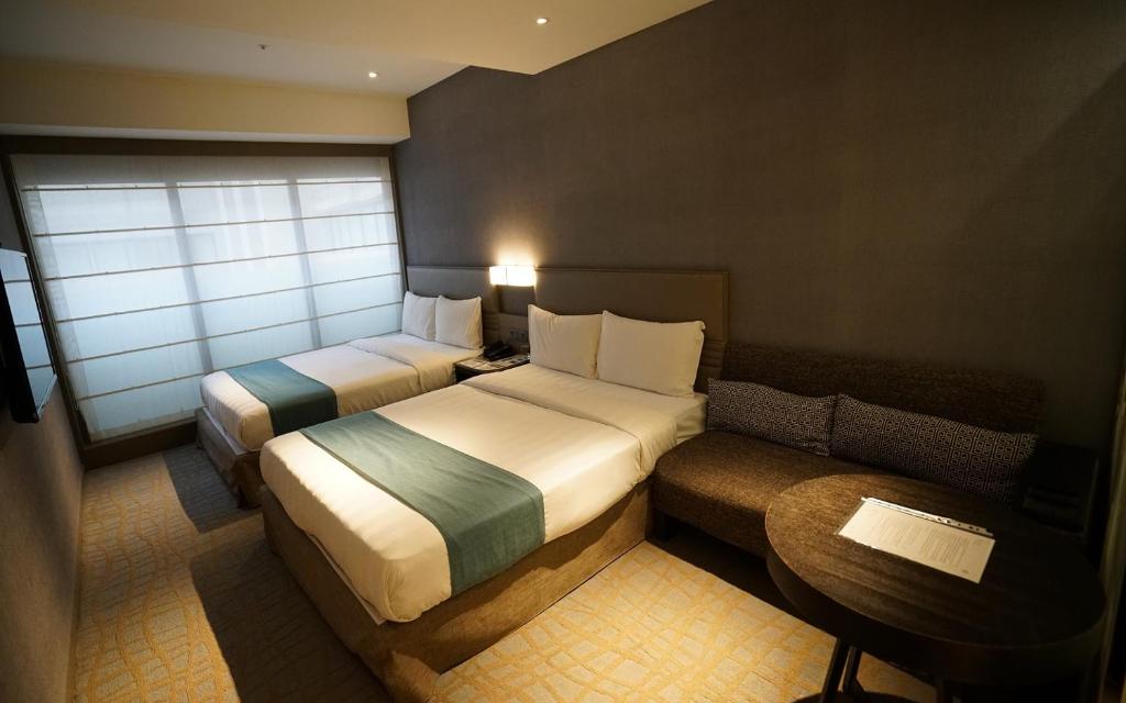 Postel nebo postele na pokoji v ubytování Hotel Midtown Richardson
