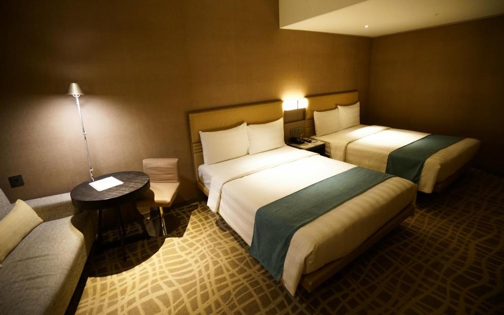 Postel nebo postele na pokoji v ubytování Hotel Midtown Richardson