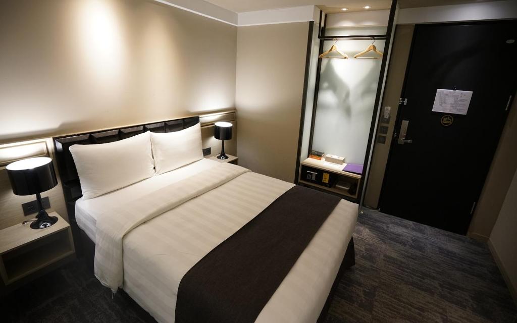 Postel nebo postele na pokoji v ubytování Hotel Midtown Richardson
