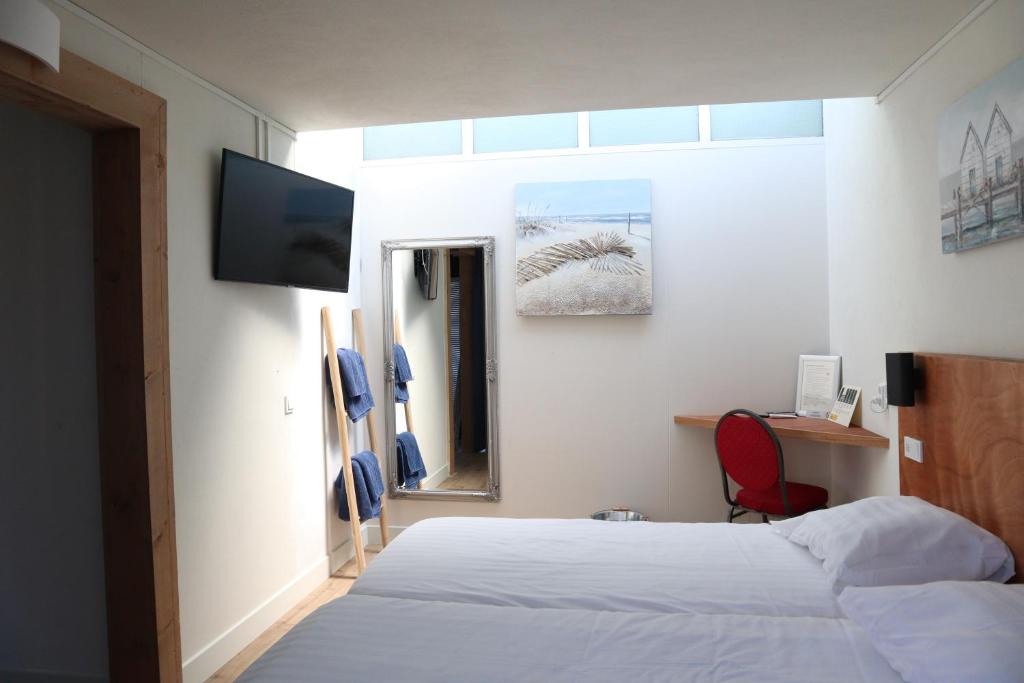 Postel nebo postele na pokoji v ubytování Bed & Ontbijt Haddock