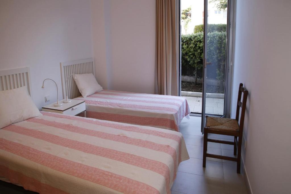 Postel nebo postele na pokoji v ubytování AT117 Planta baja con piscina, airco y a unos pasos de la playa