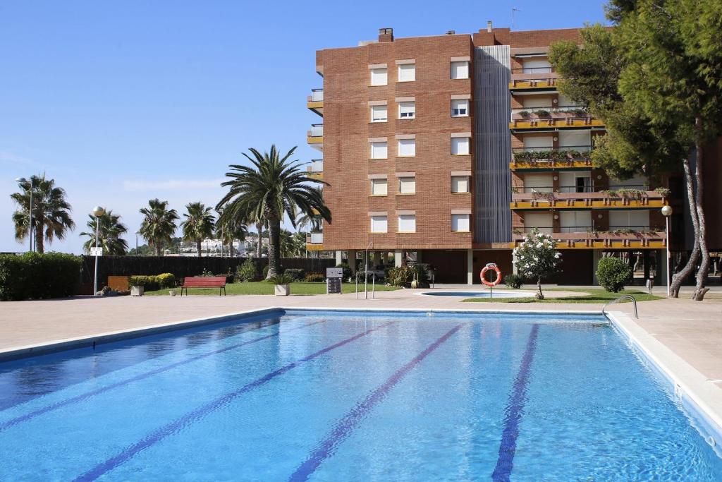 Bazén v ubytování AT132 Els Pins, 1ra línea de la playa, piscina, airco, aparcamiento nebo v jeho okolí