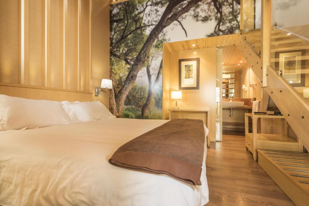Postel nebo postele na pokoji v ubytování Hotel Casa Cornel