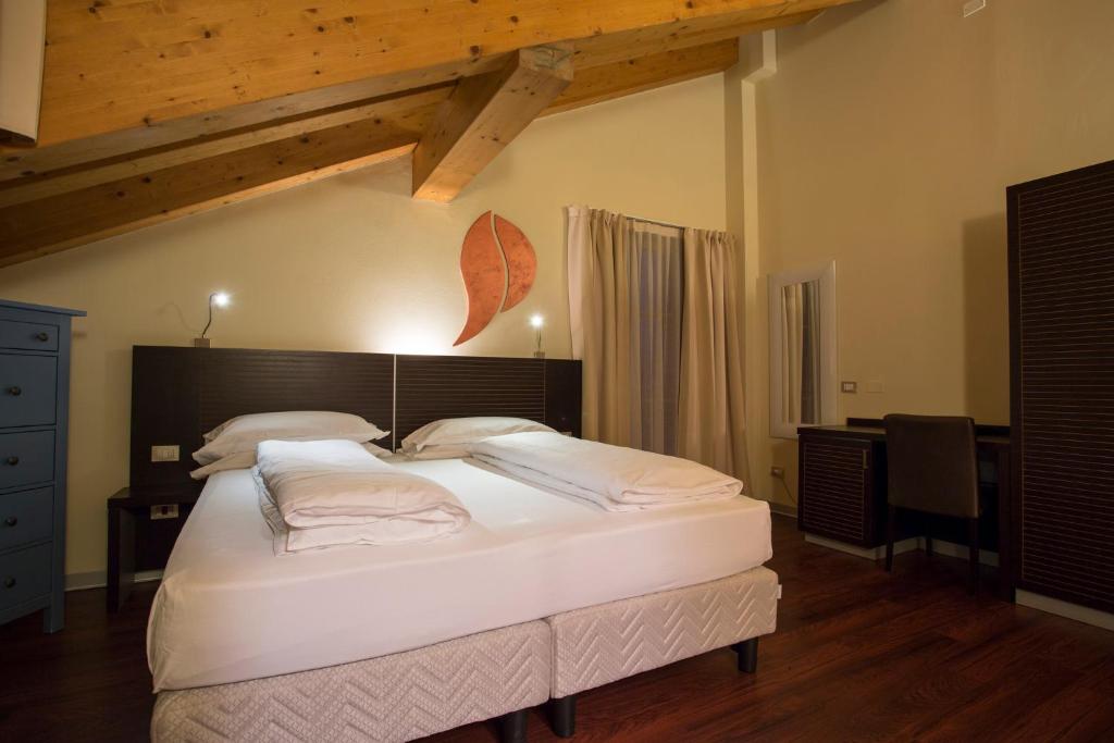 Postel nebo postele na pokoji v ubytování Hotel Norge