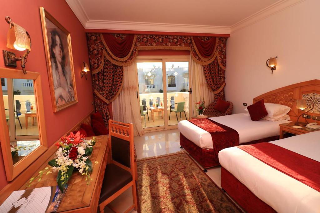 Postel nebo postele na pokoji v ubytování Oriental Rivoli Hotel & Spa
