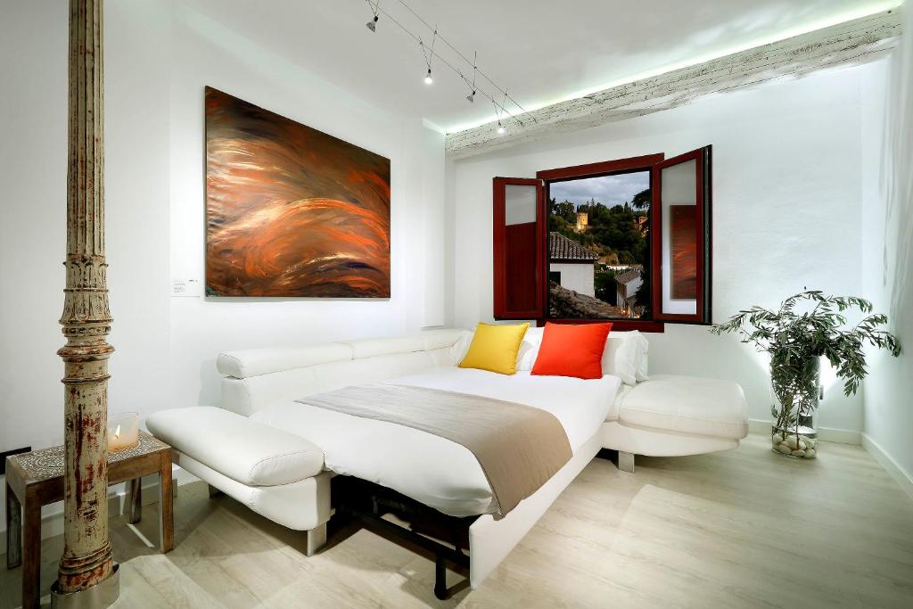 A bed or beds in a room at Art Chapiz Apartments