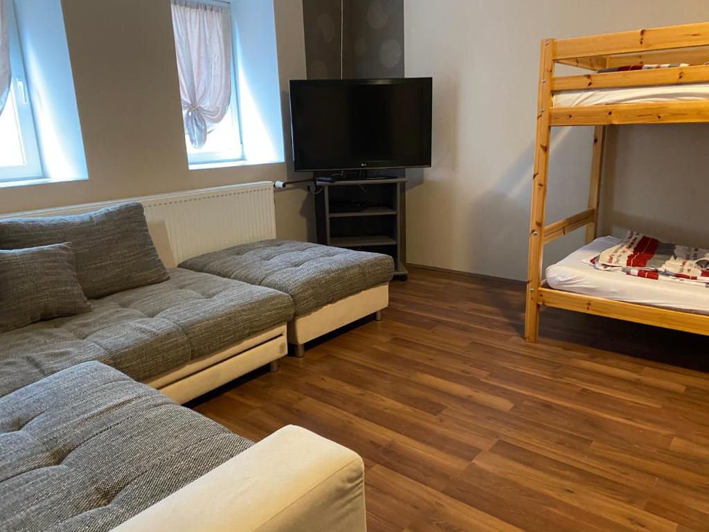 A bed or beds in a room at Virág Vendégház