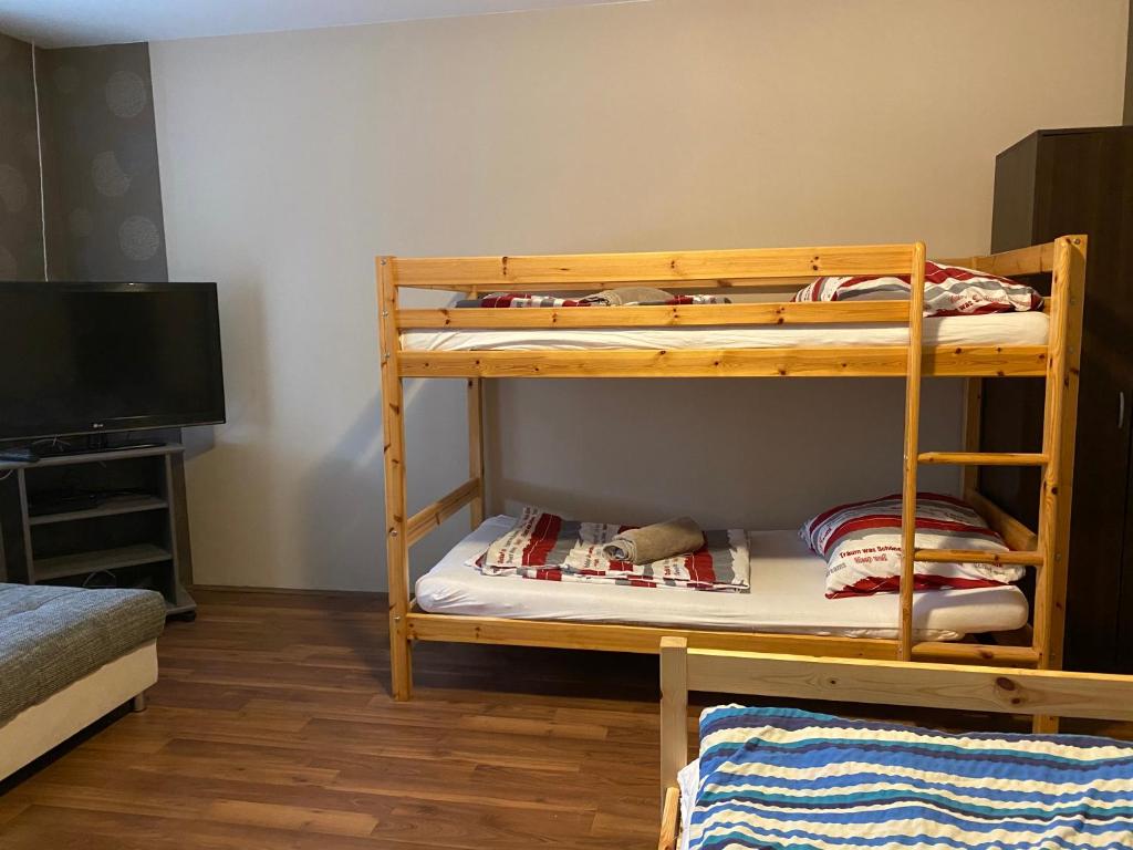 A bed or beds in a room at Virág Vendégház