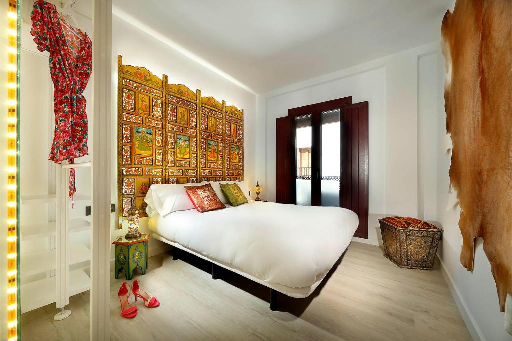 A bed or beds in a room at Art Chapiz Apartments