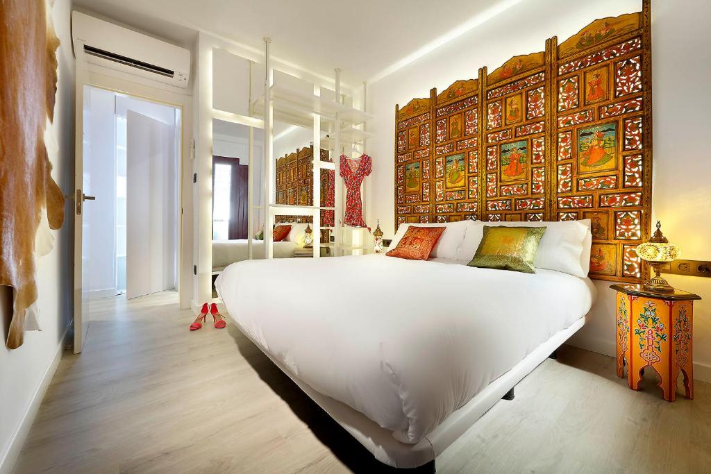 A bed or beds in a room at Art Chapiz Apartments