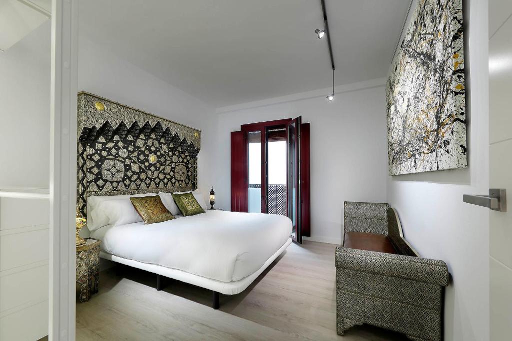 A bed or beds in a room at Art Chapiz Apartments