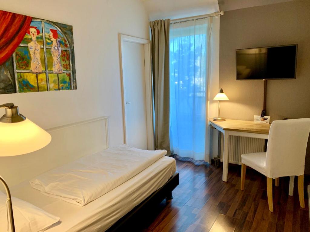 TV a/nebo společenská místnost v ubytování Hotel Toskana
