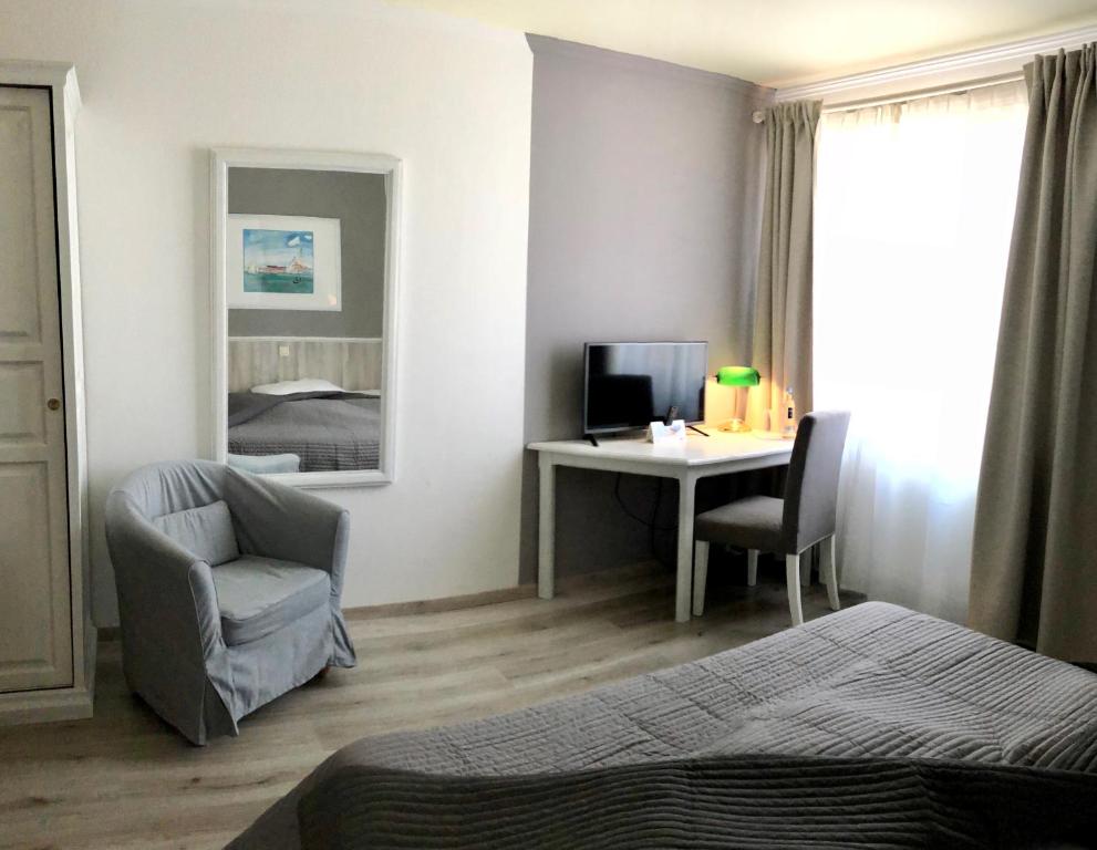 Postel nebo postele na pokoji v ubytování Hotel Toskana