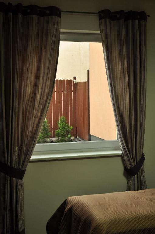 Posteľ alebo postele v izbe v ubytovaní Villa B&B