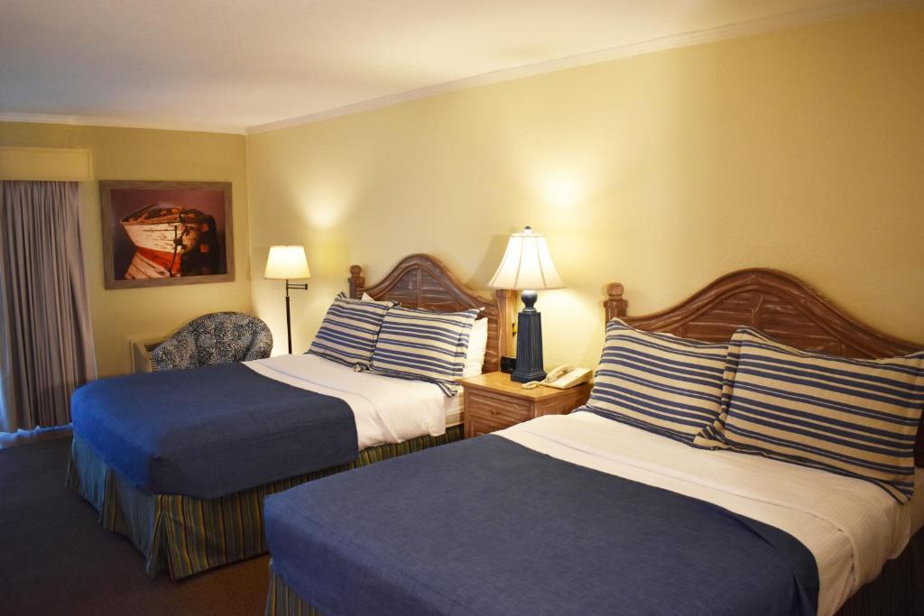 Voodi või voodid majutusasutuse Surf Side Hotel toas