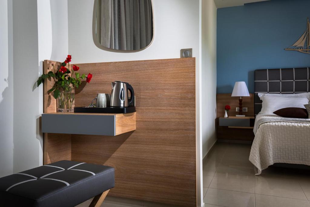 Postel nebo postele na pokoji v ubytování Hotel Porto Koufo