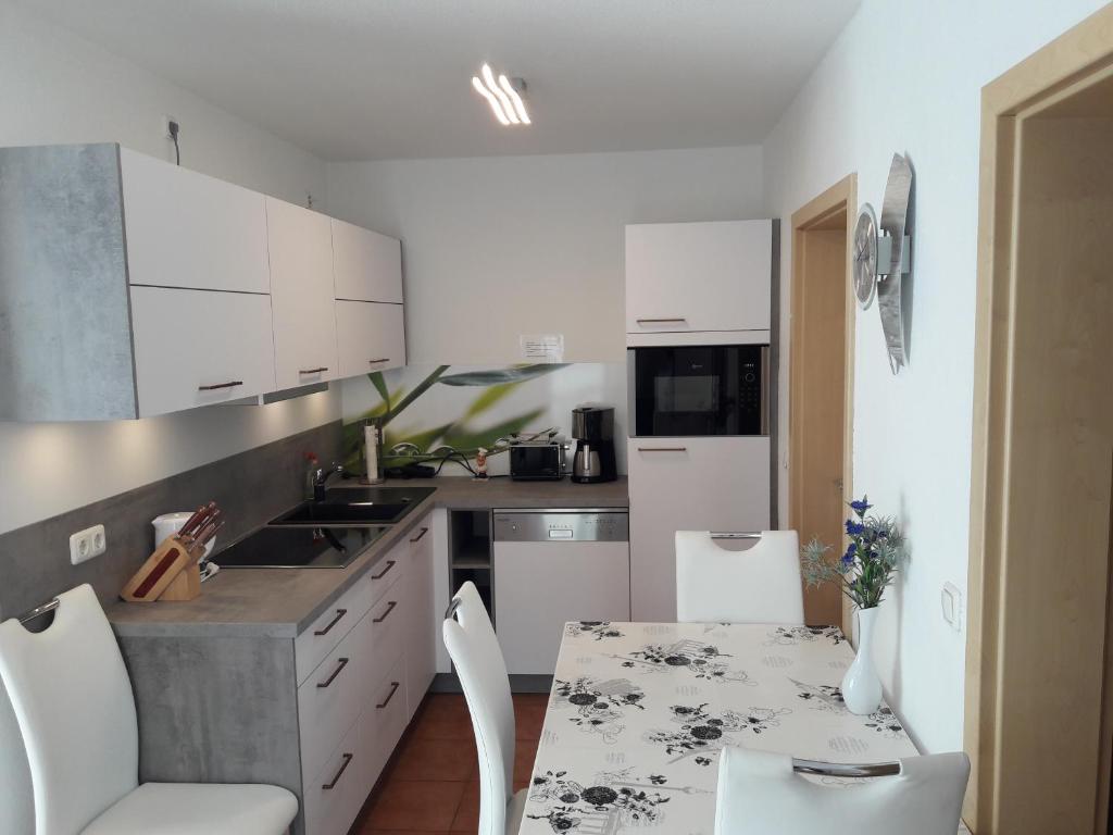Kuchyň nebo kuchyňský kout v ubytování Apartment Neptun