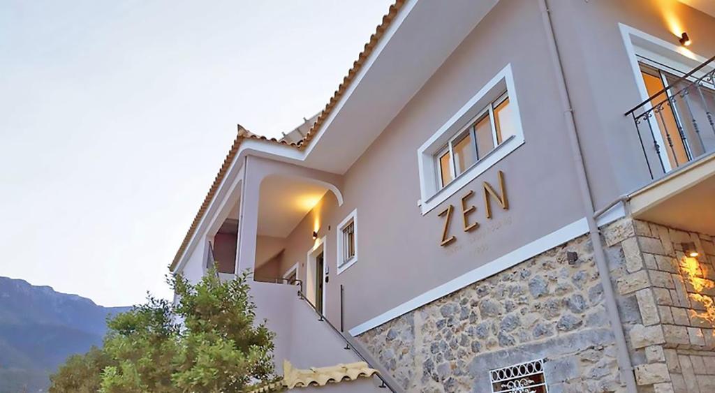 a house with a number on the side of it at ZEN Minimal Luxury Housing Tyros in Tiros