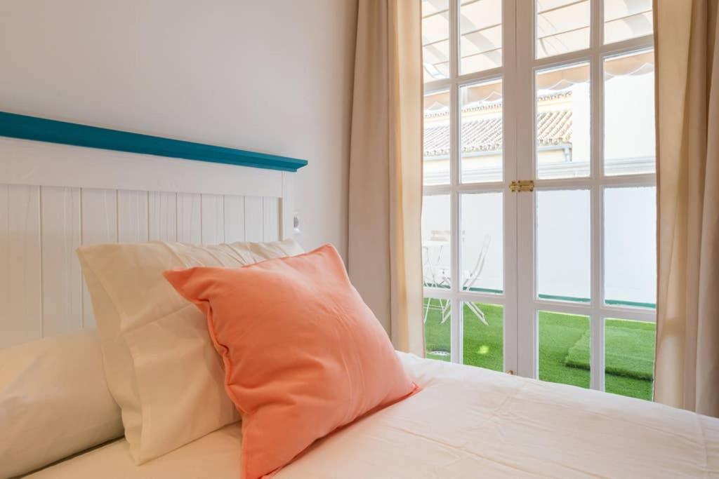 Postel nebo postele na pokoji v ubytování TGH/ Málaga Soho centro