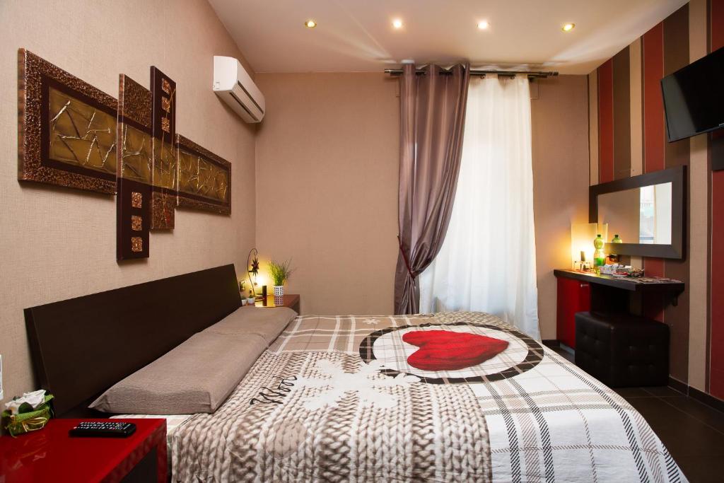 Una cama o camas en una habitación de Eritrea Suite
