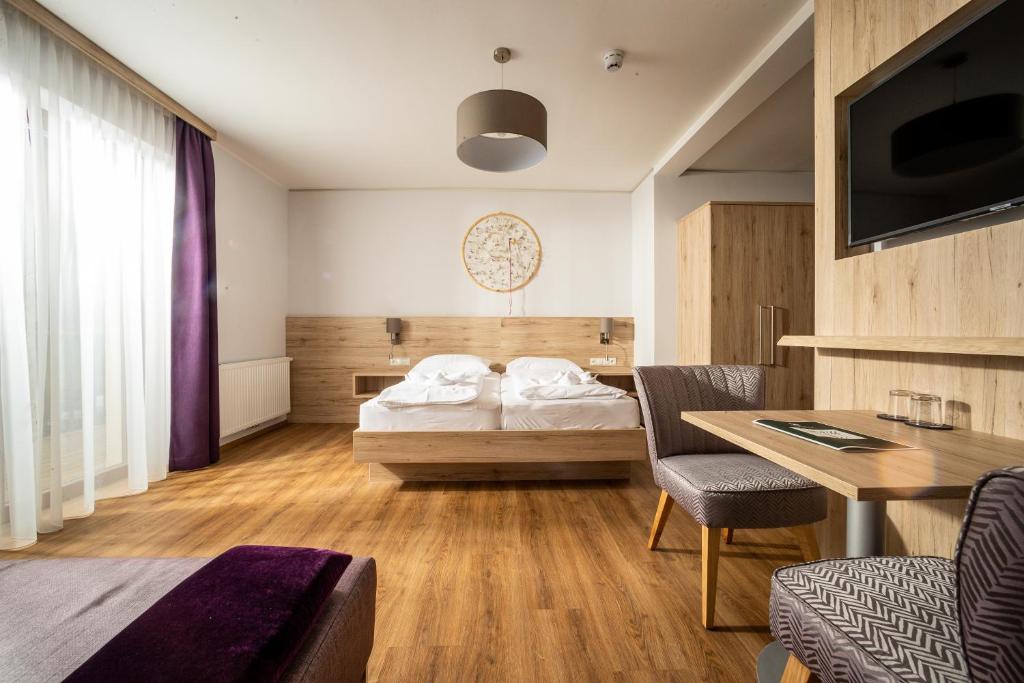 Postel nebo postele na pokoji v ubytování Hotel Mönichwalderhof