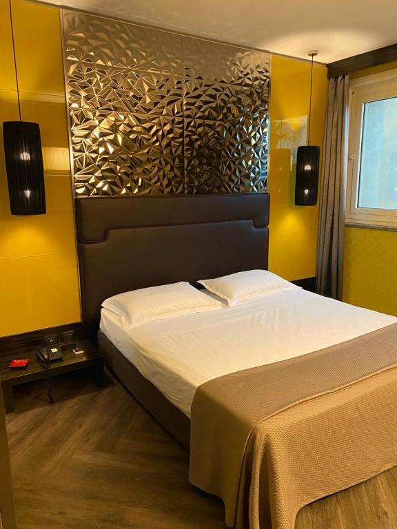 Postel nebo postele na pokoji v ubytování Iris Hotel