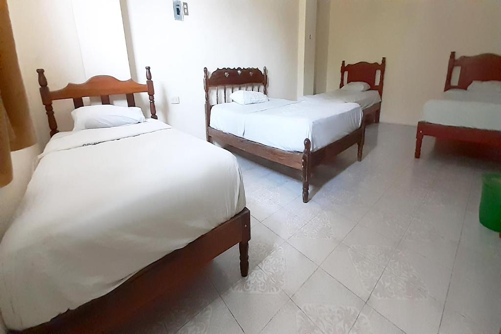 Postel nebo postele na pokoji v ubytování Hotel Costa Maria