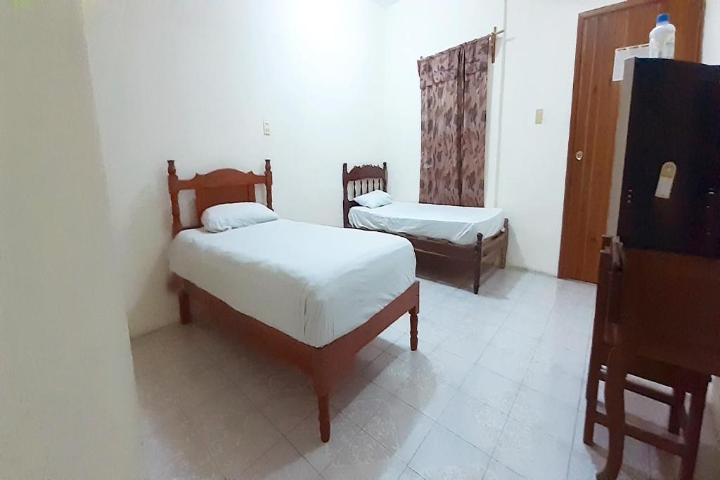 Postel nebo postele na pokoji v ubytování Hotel Costa Maria