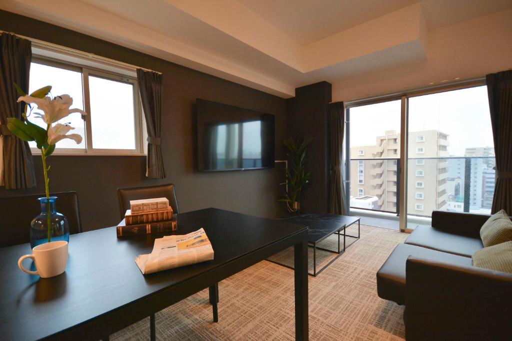 TV a/nebo společenská místnost v ubytování The Grand Residence Hotel Tenjin
