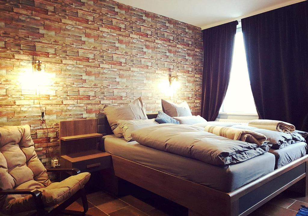Postel nebo postele na pokoji v ubytování Hotel Geismarburg