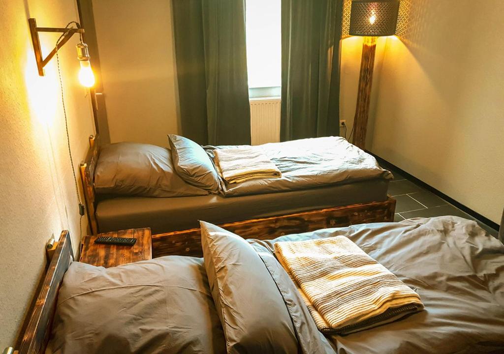 Postel nebo postele na pokoji v ubytování Hotel Geismarburg