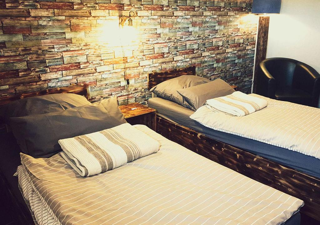 Postel nebo postele na pokoji v ubytování Hotel Geismarburg