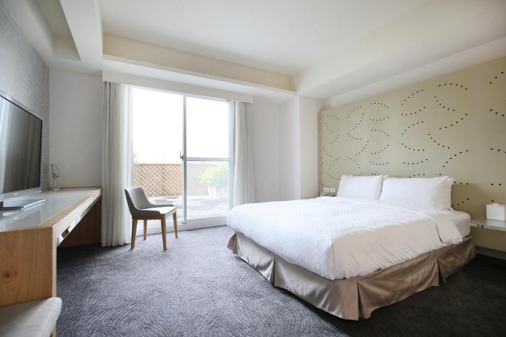 Postel nebo postele na pokoji v ubytování Dandy Hotel-Daan Park Branch