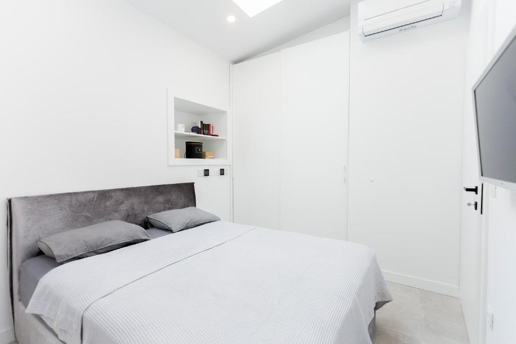 Posteľ alebo postele v izbe v ubytovaní Apartman Amore