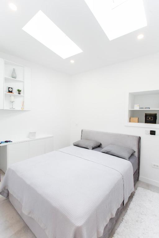 Posteľ alebo postele v izbe v ubytovaní Apartman Amore