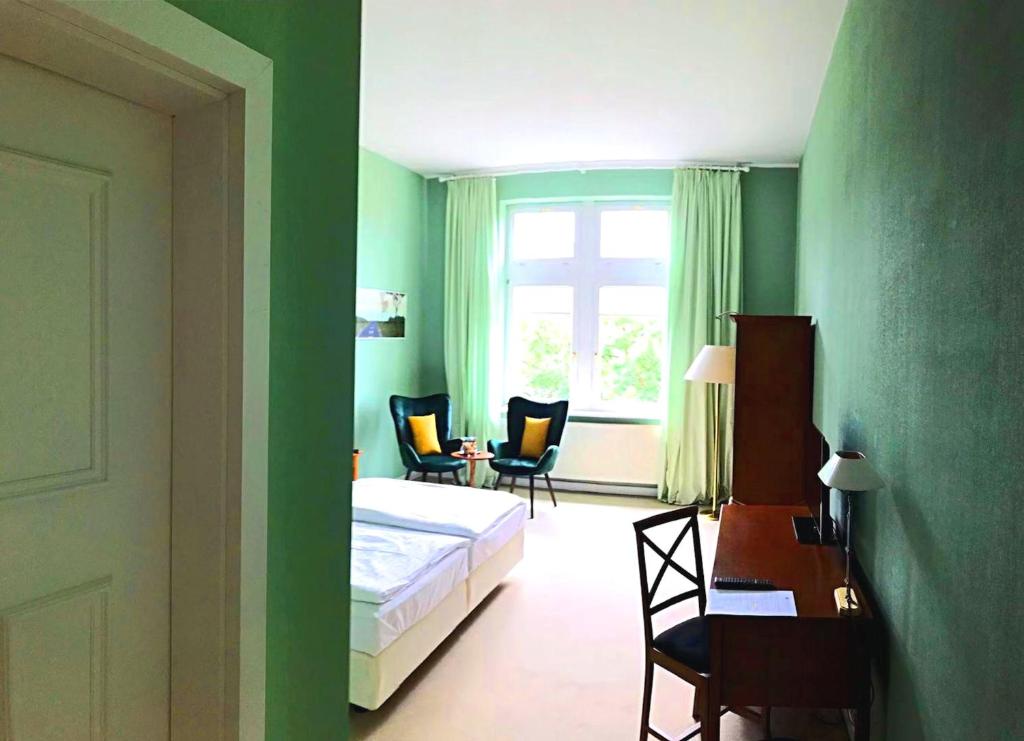 Postel nebo postele na pokoji v ubytování Hotel Villa Viktoria Luise